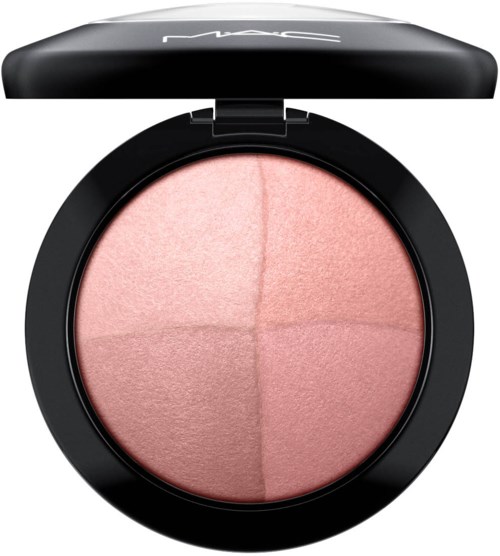 A round makeup compact with four pink blush sections inside, open to show the product. The compact is black with a brand logo on top.