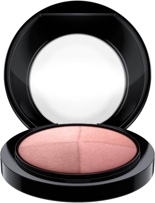 A round compact blush with a light pink color and a mirror inside the lid.