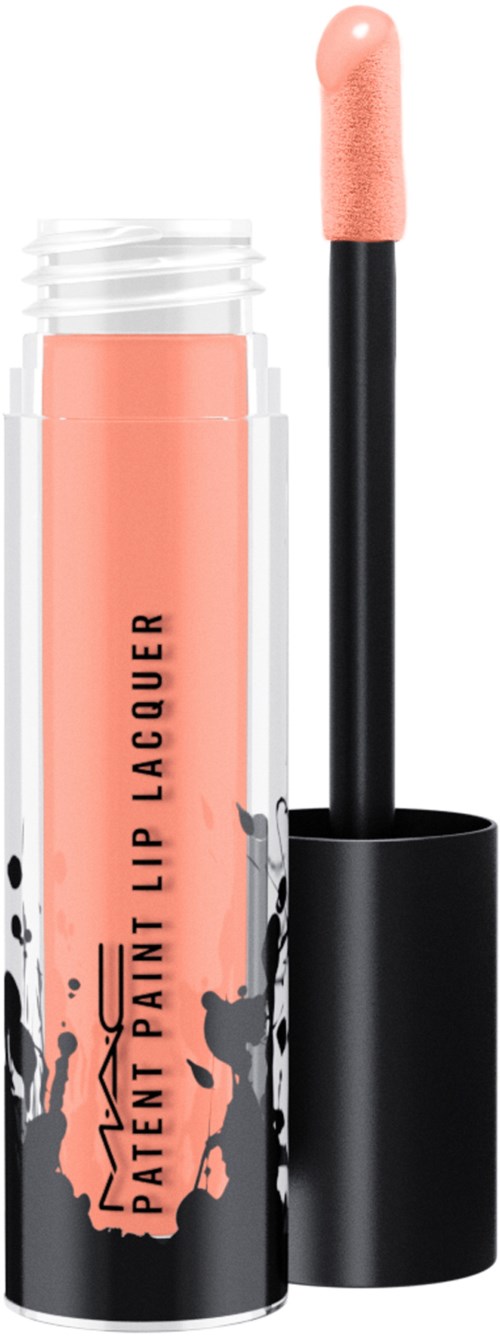 A lip gloss tube with black cap, pink product inside, and black paint splatter design on the label.