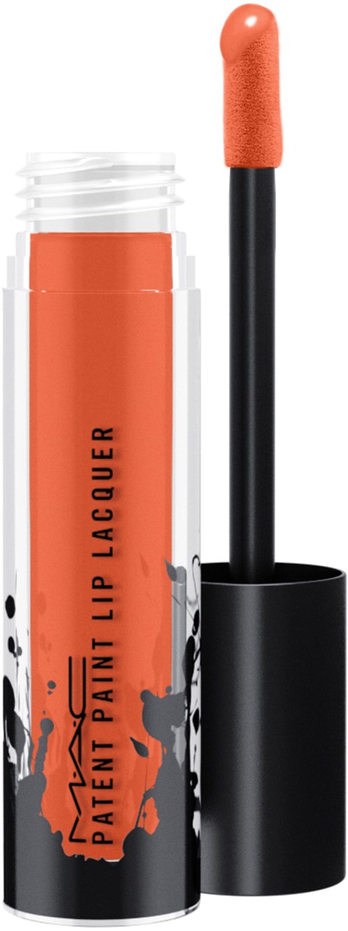 An orange lip gloss in a tube with black and orange splash design, and an applicator brush outside.