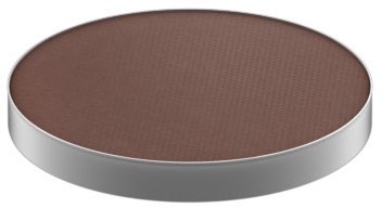 En rund brun föremål med vit kant, troligtvis en chokladkaka eller kex.