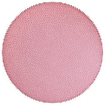 En rund, rosa makeuppuder eller rouge med en texturerad yta.