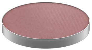 A round, pink makeup blush with a silver edge and textured surface.