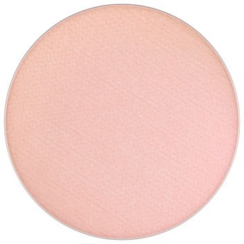 En rund, ljusrosa makeup blush eller puder med en slät yta.