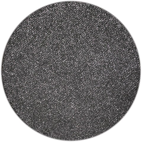 En rund, svart texturerad yta med små vita prickar. Ser ut som en närbild av ett grovt, mörkt material.