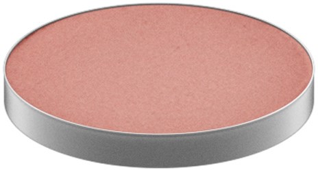 En rund, flad genstand med en pink, struktureret overflade og en sølvkant.