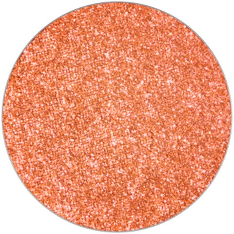En rund, skinnende, glitteraktig oransje overflate med mange små glitrende partikler.