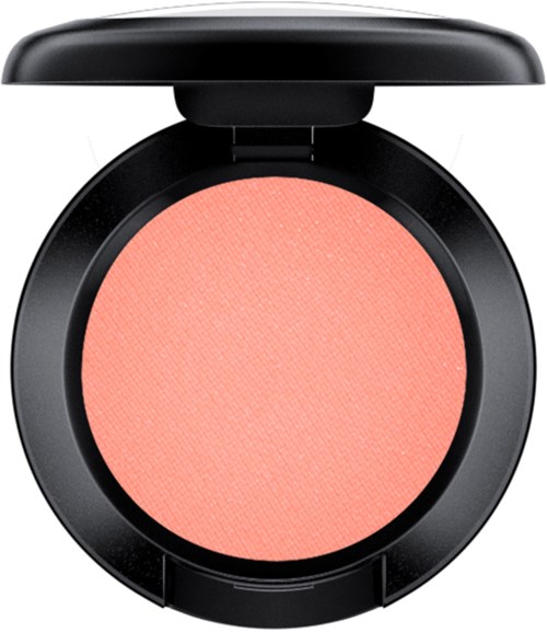 Ein rosa Rouge in einer runden schwarzen Compact mit Deckel, kein Pinsel vorhanden.