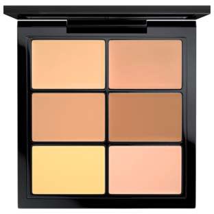 En makeup-palette med seks forskellige nuancer af foundation eller concealer i sort hold.