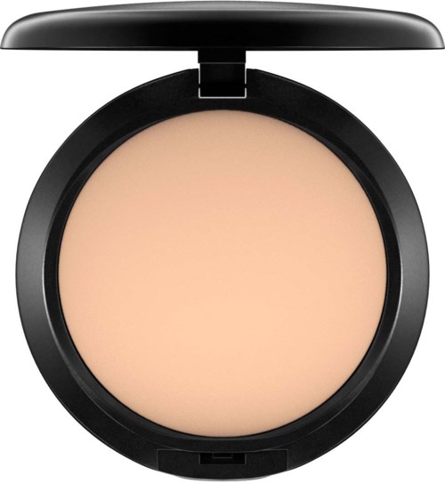 A round compact with beige pressed powder inside, black exterior, and a lid that is open.