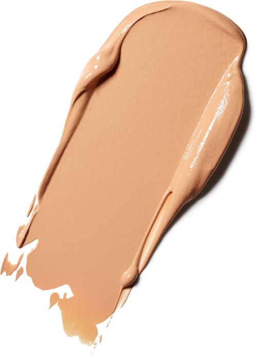 Et strøg af beige makeup eller foundation med en glat, cremet tekstur på en hvid baggrund.