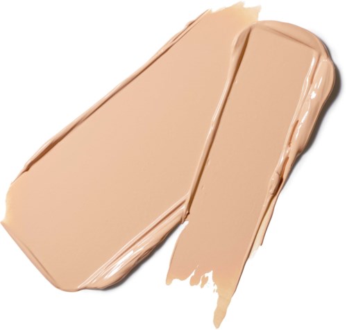 En beige foundationprøve fordelt på en hvid baggrund med cremet tekstur.