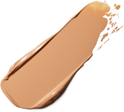 Ett streck av ljusbrun flytande makeup med några droppar runtom, på en vit bakgrund.