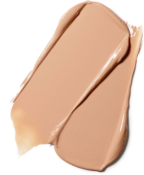 Cremige beigenfarbene Make-up-Prägung auf Haut mit sichtbarer Textur. Glatte und glänzende Oberfläche. Sieht aus wie Foundation oder Concealer.