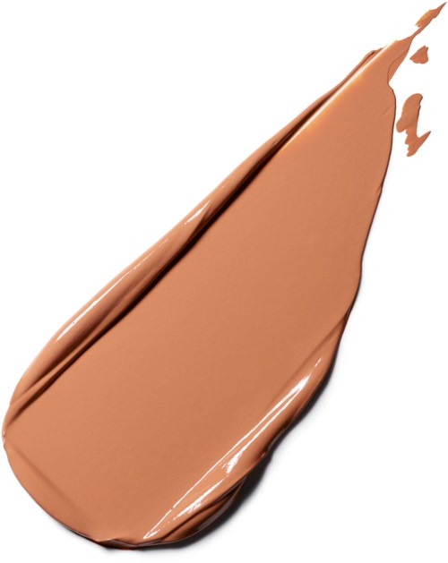 Prøve af lysbrun eller beige flydende foundation eller concealer med børstestreg. Glat og cremet tekstur.
