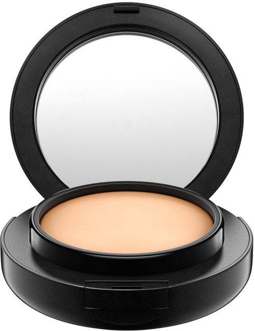 Ein kompakter Make-up-Foundations-Behälter mit Spiegel und beige Puder.