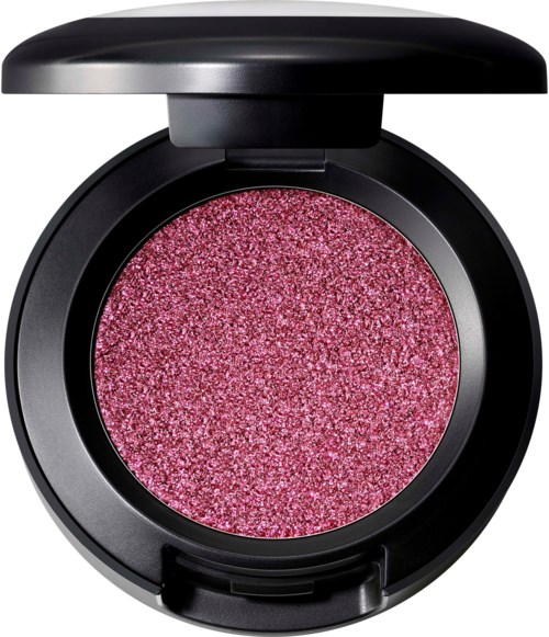 Een roze, glinsterende ronde make-up blush compact met een gesloten zwart deksel.