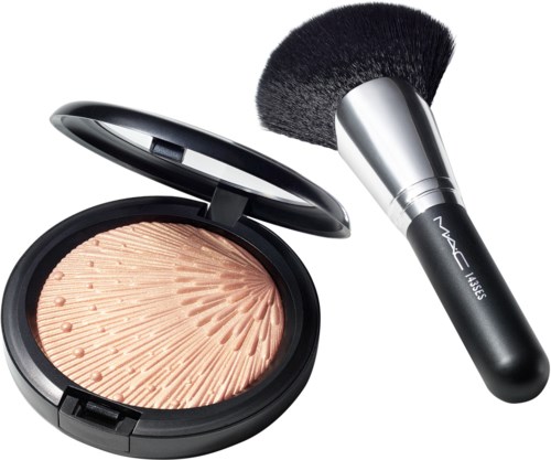 A compact with powder and a large makeup brush for applying it.