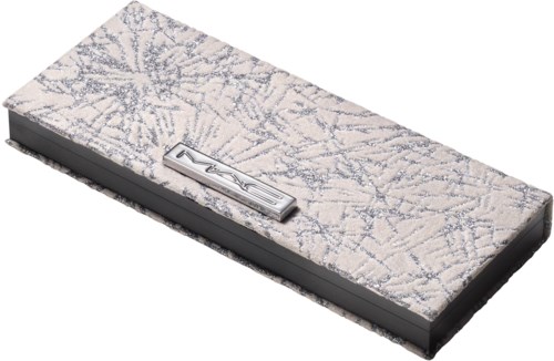 A rectangular case with a snowflake pattern and a silver brand label on top.