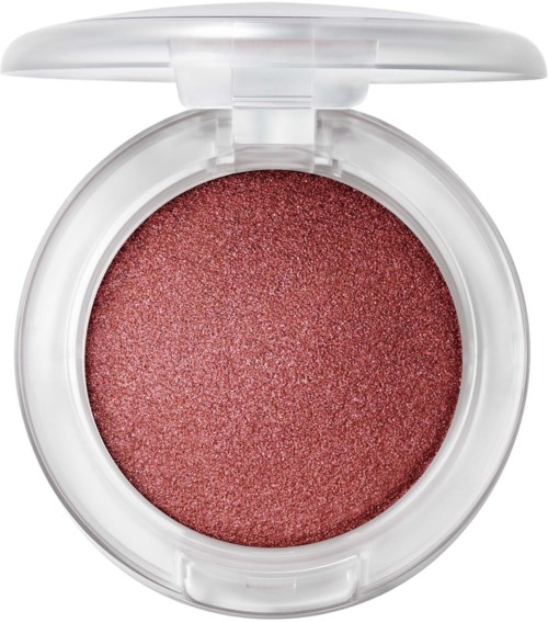 Shimmering coral-pink blush in a white compact with a clear lid. No text or labels visible.
