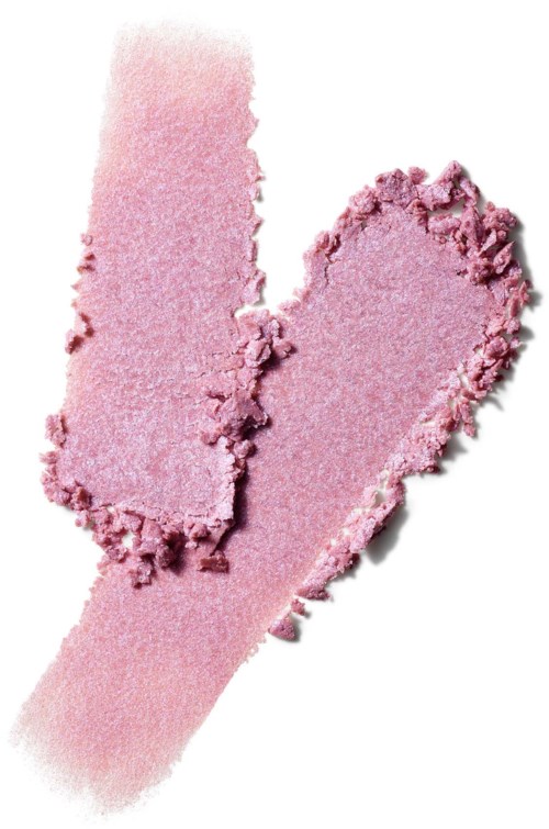 Pink blush powder with a heart-shaped section and a smear of the same color on white background.