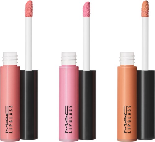 Three MAC lip glosses in pink, peach, and beige with applicators showing the gloss. They are standing upright.