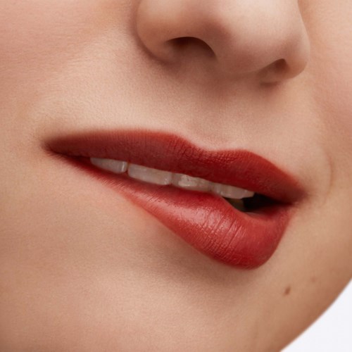 Close-up of a person's lips with red lipstick, slightly open showing teeth, and skin visible around the lips.