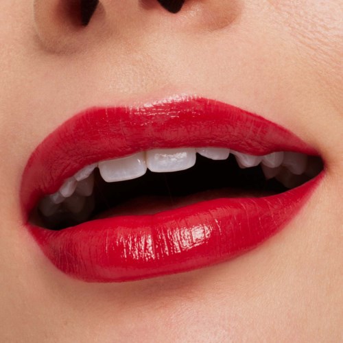 Close-up of lips with red lipstick and missing upper front teeth.