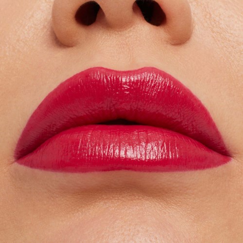 Close-up of lips with bright red lipstick and part of nose visible.