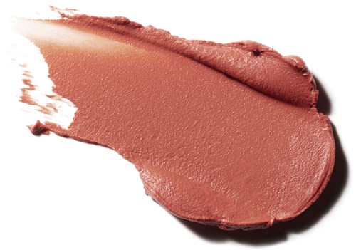 A smear of pinkish-brown lipstick on a white background with some uneven edges and texture.