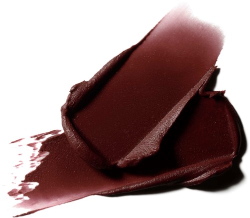 A dark red lipstick is partially open, with lipstick smeared on a white surface.