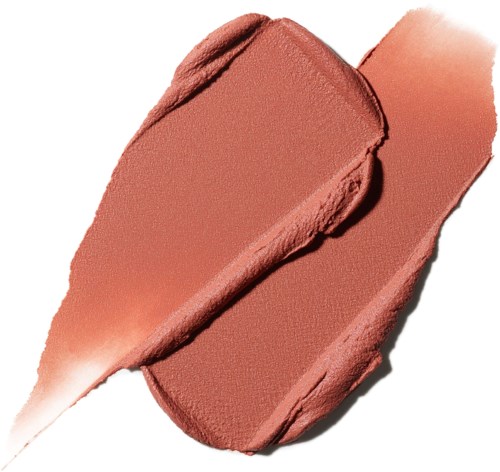 A makeup product, soft pink blush spread out with a brush stroke, textured surface visible.