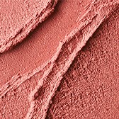 A textured pink surface with lines and rough patches in a close-up view.