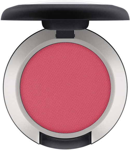 En rund lyserød blush i en compact med sort låg åben.