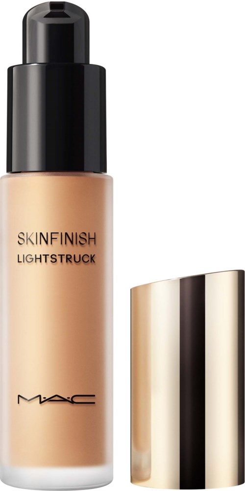 En flaske MAC Skinfinish Lightstruck foundation med guldlåg, sort pumpe og produktnavn på flasken.