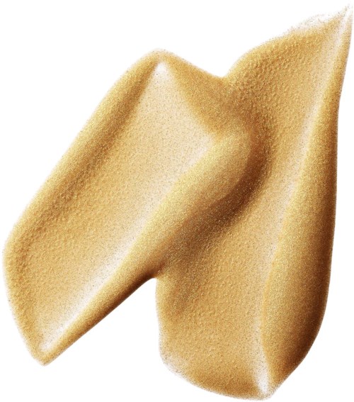 En klat beigefarvet, cremet, glat lotion eller foundation på hvid baggrund.