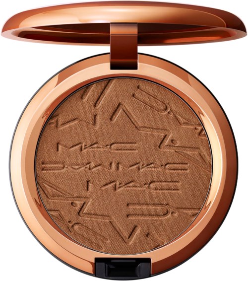 A round makeup compact with a shiny rose gold lid open, revealing brown powder with textured lines.