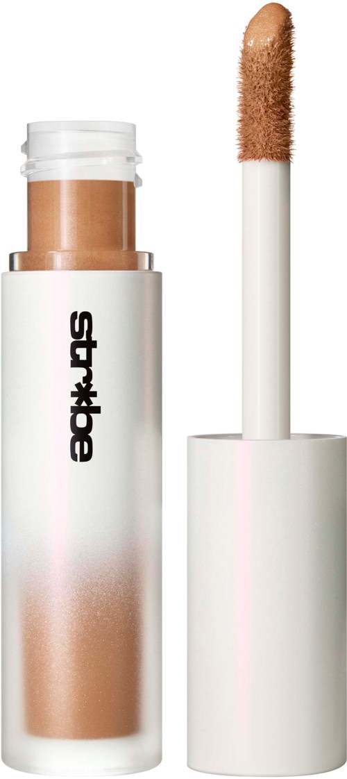 En makeuppenna med ljusbrun täckning och vit bas, märkt "SYLAX". Applicatorpinnen syns.