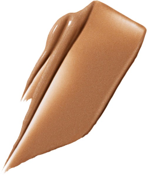 En sked med ljusbrun till mörkbeige krämig substans, slät och tjock, möjligen choklad eller pålägg.