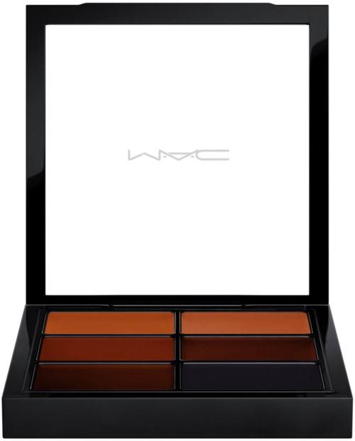 Een make-up palet met zes tinten bruin en oranje, in een zwart doosje met een spiegel.