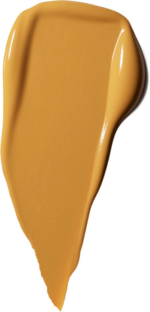A smear of beige-colored liquid makeup or foundation with a slightly curved shape.