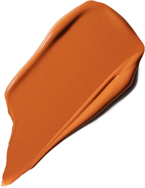 A smear of brown liquid, smooth and creamy, with a slight curve and shiny surface.