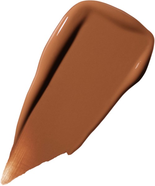 Een bruine make-up foundation vlek op een witte achtergrond. Het is glad en romig van textuur.
