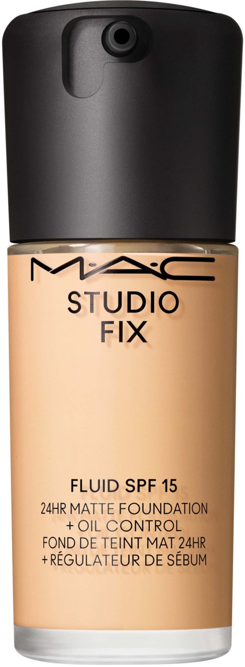 Eine beige Foundationsflasche mit schwarzem Deckel, beschriftet 'MAC Studio Fix' und 'SPF 15' für Hautabdeckung.