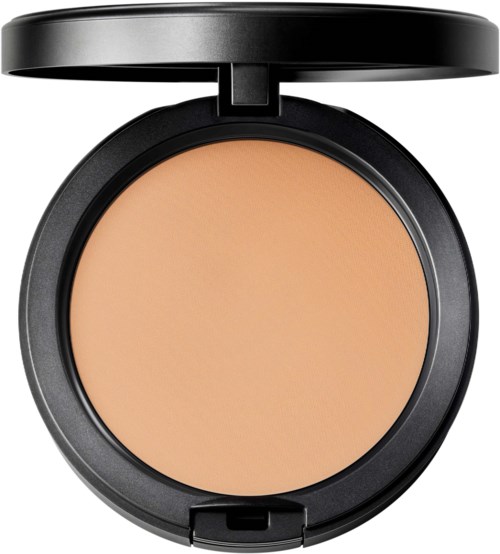 A compact with beige face powder inside, black round case, and open lid.