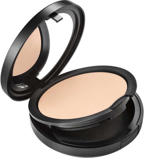A compact makeup case with pressed powder and mirror inside, black outer case and beige powder.