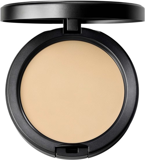 A round compact with beige pressed powder and a black lid open.