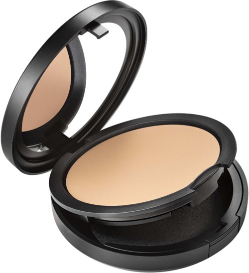 A compact makeup case with beige powder, open lid, black case, small mirror inside, designed for face makeup.