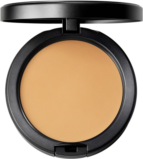 A round black compact with beige powder inside and a small mirror lid above it.