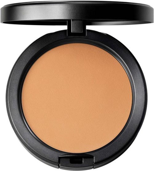A compact makeup container with tan-colored powder inside and a black lid.